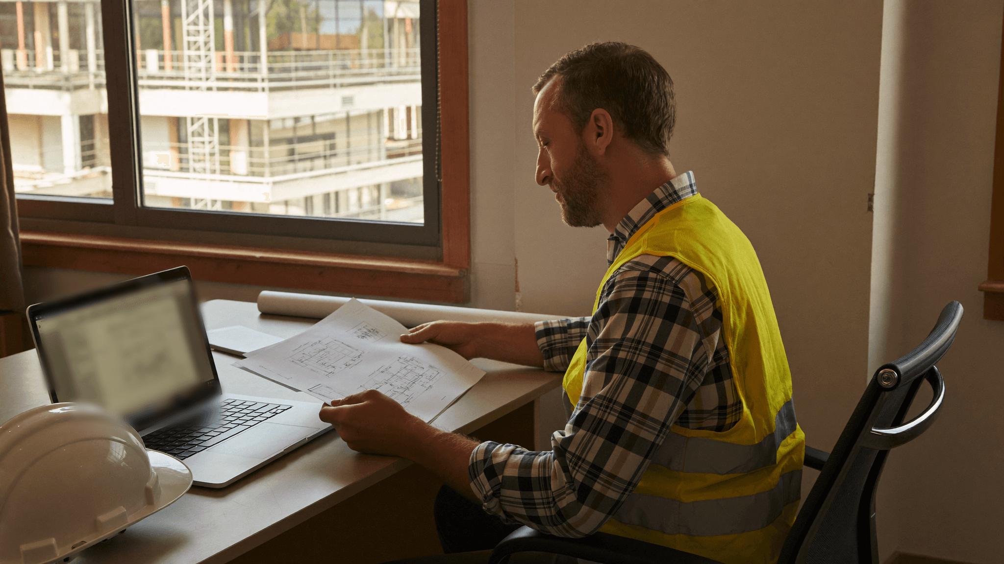 A project manager at a construction site office