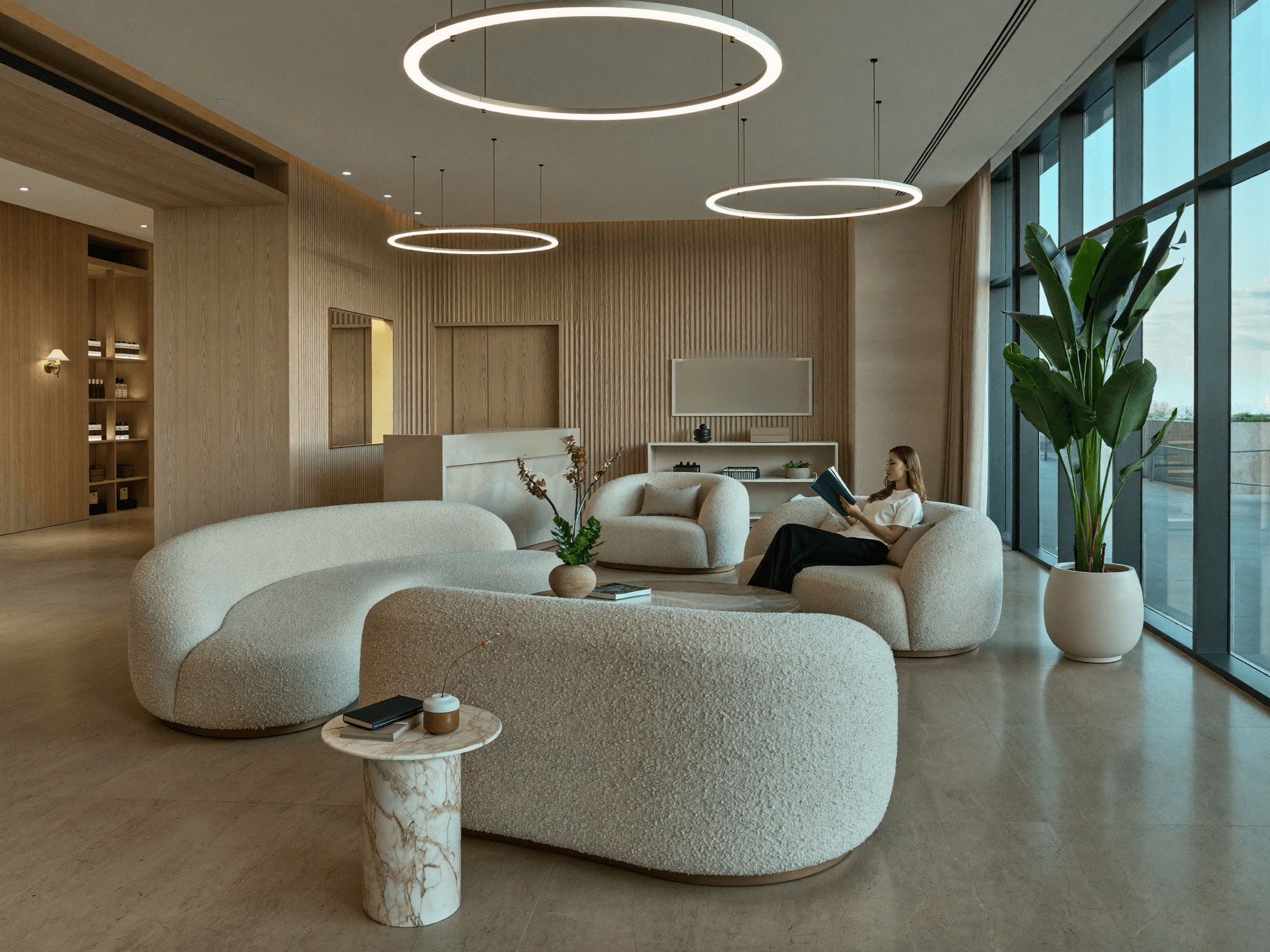 A patient relaxing in a calm modern med spa lounge